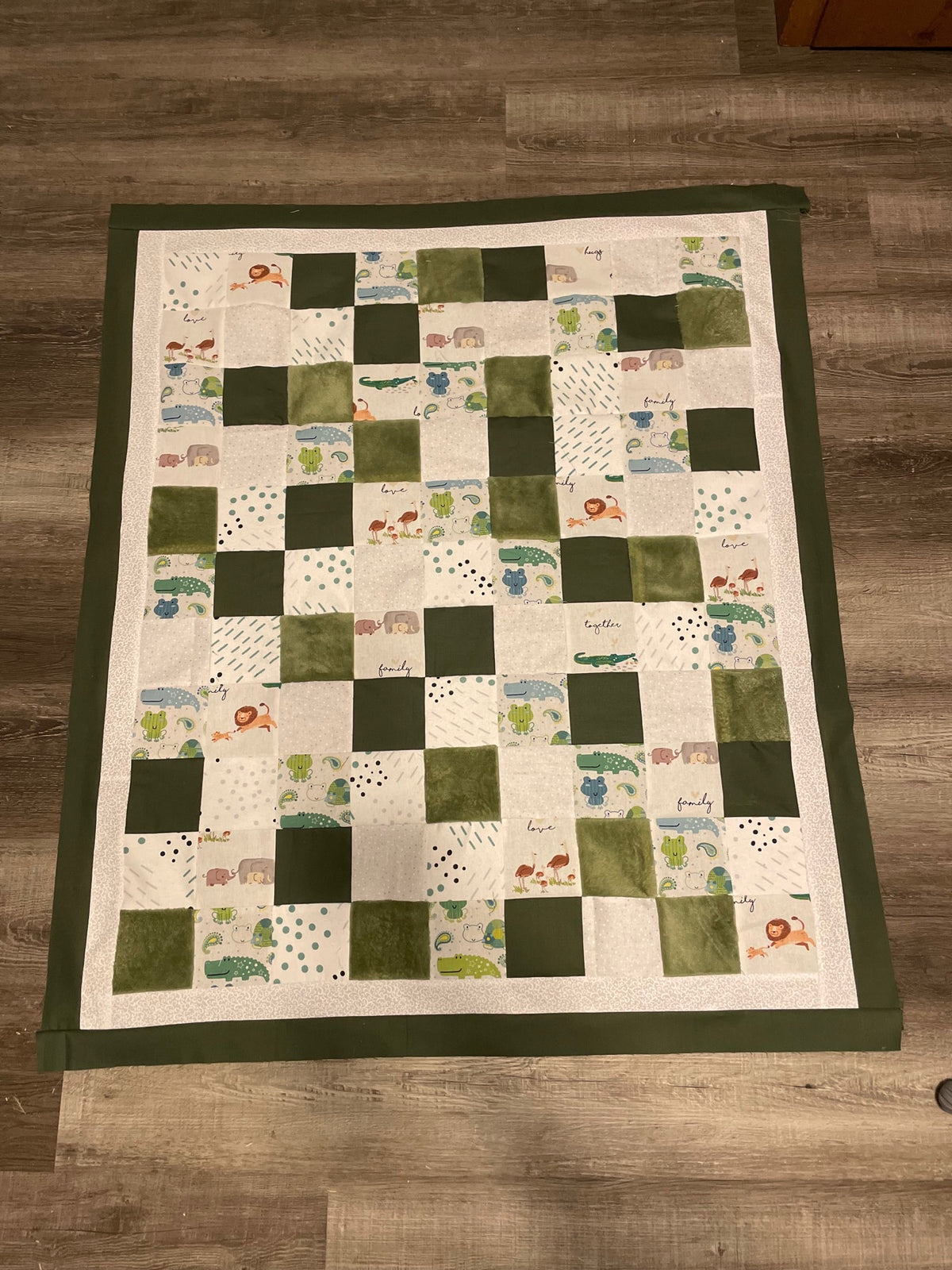 Green and cream patchwork quilt