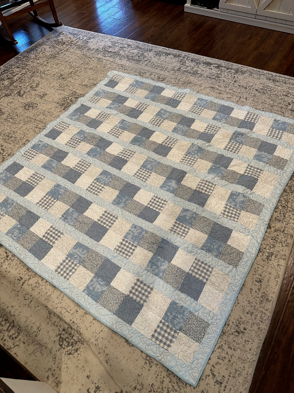 Soft blue and gray patchwork quilt