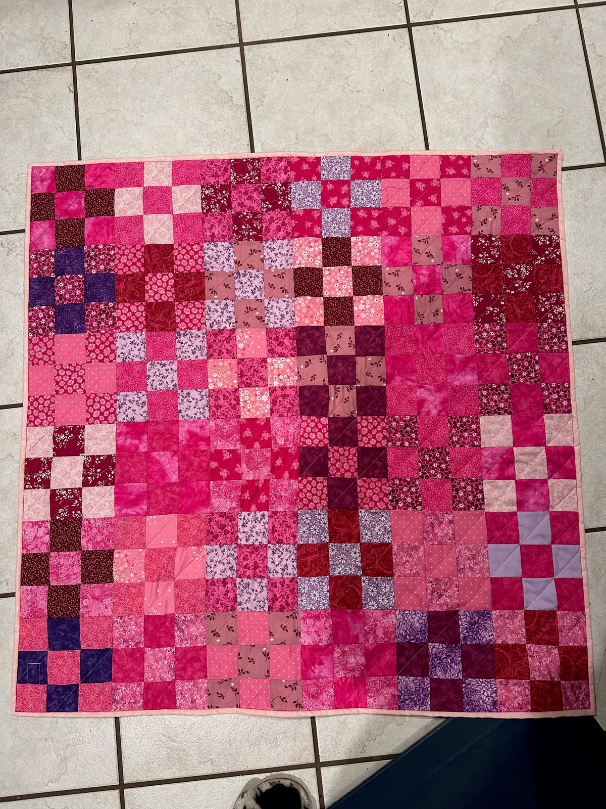 Pink checkerboard quilt