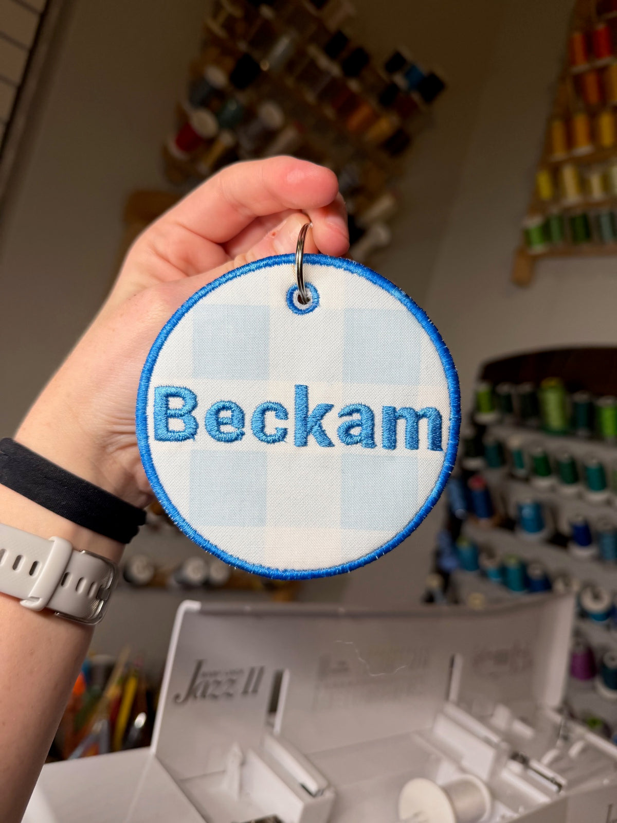Blue embroidered round name tag