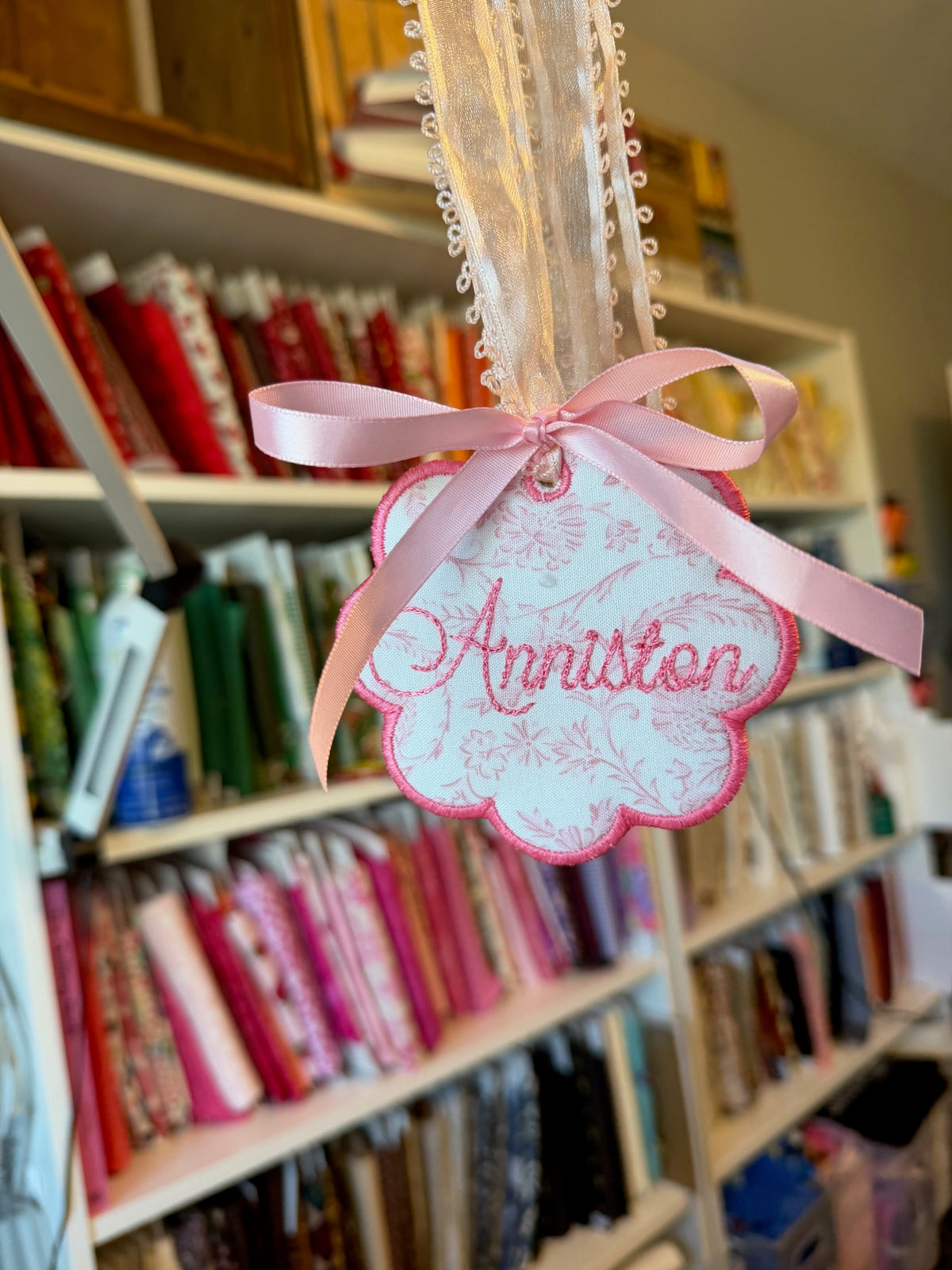 Pink embroidered name banner